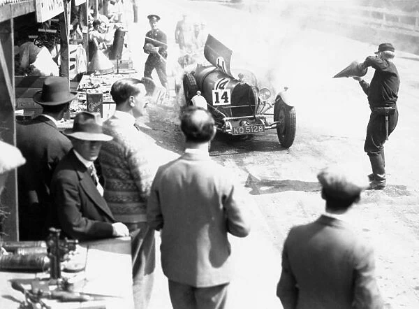 1929 Irish Grand Prix. Car number 14, catches fire in the pit lane, action
