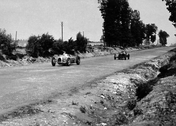 1934 French Grand Prix. Montlhery, France. 1 July 1934. August Momberger, Auto Union A, retired, leads Louis Chiron, Alfa Romeo Tipo-B 'P3', 1st position, action. World Copyright: Robert Fellowes  /  LAT Photographic Ref: 34FRA06
