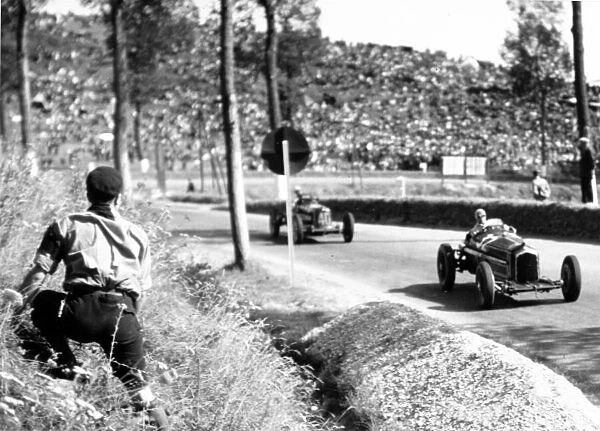 1935 Dieppe Grand Prix. Dieppe, France. 21 July 1935. Louis Chiron, Alfa Romeo Tipo-B 'P3', 2nd position, leads Giuseppe Farina, Maserati 6C-34, 5th position, action. World Copyright: Robert Fellowes / LAT Photographic Ref: 35DIE02