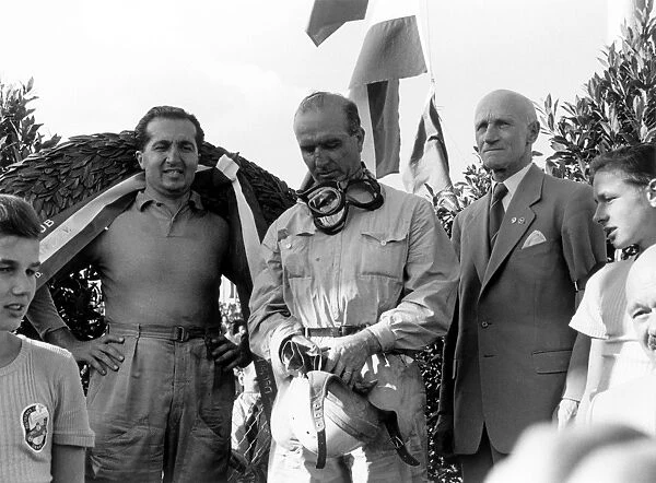 1952 German Grand Prix - Podium: Alberto Ascari, 1st position, left and Giuseppe Farina, 2nd position, centre, on the podium