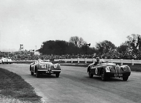 1952 International Car Race Meeting. Goodwood, England. 14th April 1952. John B. Swift (Jaguar XK120), 2nd position leads Duncan Russell (Jaguar XK120), 5th position, action. World Copyright: LAT Photographic. Ref: B / W Print