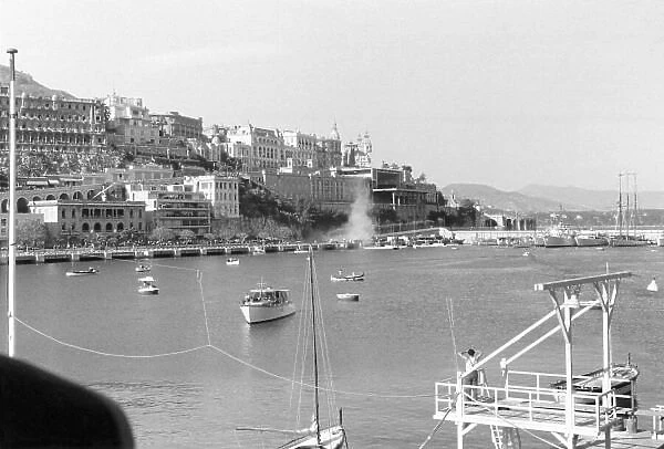 1955 Monaco Grand Prix Monte Carlo, Monaco. May 22. Alberto Ascari's Lancia D50 crashes into the harbour leaving a cloud of smoke. Ascari survived the crash, only to be killed four days later in testing at Monza. World Copyright: LAT Photographic