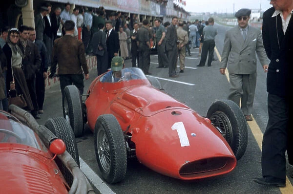 1956 French Grand Prix Reims, France. 29th June - 1st July. Maserati 250F Chassis no. 2501 is prepared in the pits as a crowd of people watch on. World Copyright: LAT Photographic ref: 56 FRA 16