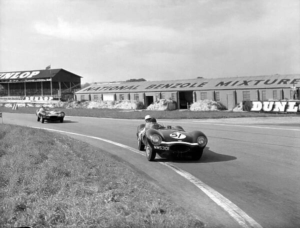1956 Whitsun Trophy. Goodwood, Great Britain. 20th - 21st May 1956. Ron Flockhart (Ecurie Ecosse Jaguar D-type), 3rd position leads leads Desmond Titterington (Ecurie Ecosse Jaguar D-type), 1st position, action. World Copyright: LAT Photographic