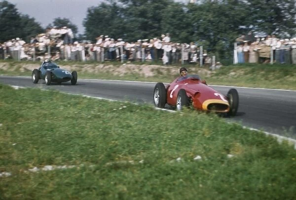 1957 Italian Grand Prix: Juan Manuel Fangio leads Stuart Lewis-Evans. Fangio finished in 2nd position