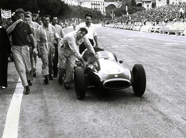 1957 Monaco Grand Prix: Jack Brabham pushes his Coper across the finish line