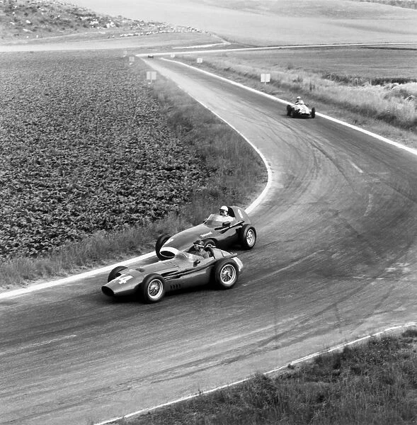 1958 French Grand Prix: Juan Manuel Fangio, 4th position, leads Stirling Moss, 2nd position, action