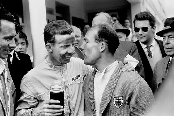 1958 German Grand Prix: Tony Brooks 1st position, drinks from a flask with team mate Stirling Moss retired, portrait