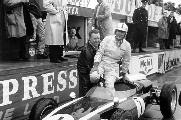 1960 British Grand Prix: Jack Brabham, Cooper T53-Climax, 1st position, in the pits, portrait