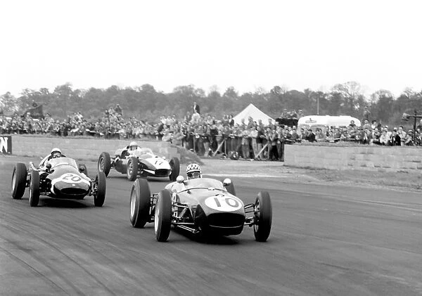 1960 International Trophy, Silverstone, England: Innes Irelands Lotus 18 leads Stirling Moss in a Cooper T51 and Keith Greene in a Cooper T45