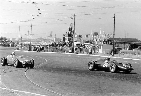1960 Portuguese Grand Prix. Oporto, Portugal. 12-14 August 1960. Dan Gurney (BRM P48) leads Wolfgang von Trips (Ferrari Dino 246). Von Trips finished in 4th position. World Copyright: LAT Photographic Ref: Autosport b&w print