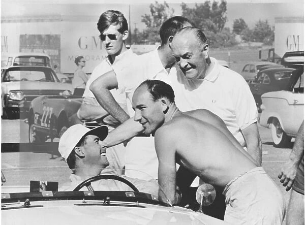 1961 3 hour Production Car Race: Stirling Moss  /  Jack Brabham, 3rd position, chat in the pits, portrait