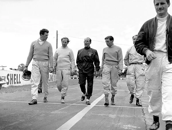 1961 British Empire Trophy: L to R: Tim Parnell, Innes Ireland, Stirling Moss, Jim Clark, Jack Fairman and Lucien Bianchi walk to the start line, portrait