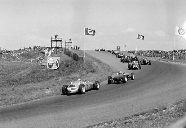 1961 Dutch Grand Prix - Start: Hans Herrmann follows the field after the start. In the distance Wolfgang von Trips leads Graham Hill, Phil Hill