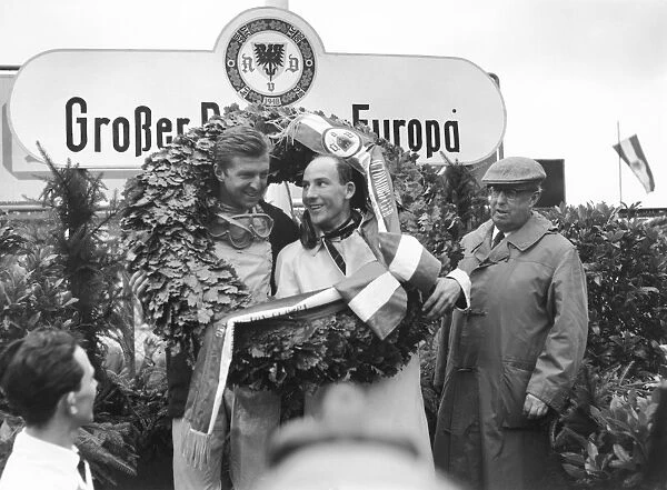 1961 German Grand Prix: Wolfgang von Trips and Stirling Moss celebrate on the podium, portrait