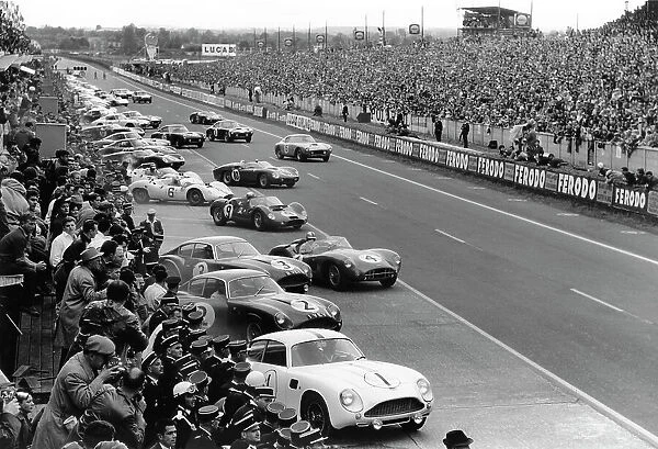 1961 Le Mans 24 hours - Start: The cars and drivers make the traditional LeMans start behind Jean Kerguen  /  Jacques Dewez. Roy Salvadori  /  Tony Maggs