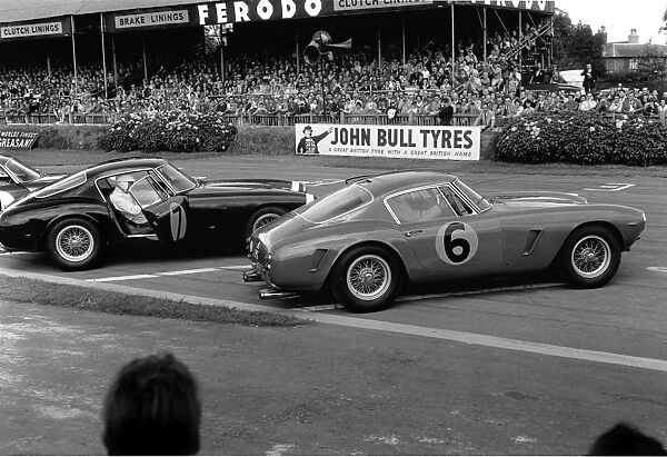 1961 RAC Tourist Trophy: Stirling Moss, 1st position, leads Mike Parkes, 2nd position, action