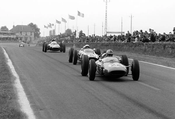 1962 Reims Grand Prix: Jack Brabham leads Bruce McLaren and Graham Hill. They finished in 4th, 1st and 2nd position respectively