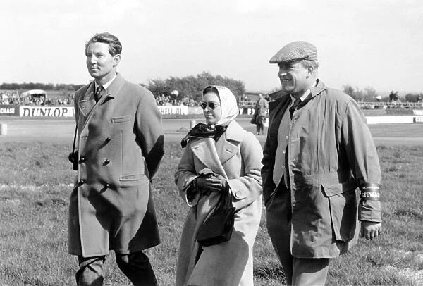 1963 International Trophy. Silverstone, Great Britain. 11 May 1963. Left-to-right: Lord Snowdon and HRH Princess Margaret are escorted by Hon. Gerald Lascelles of the BRDC. Portrait, vip guest, royalty