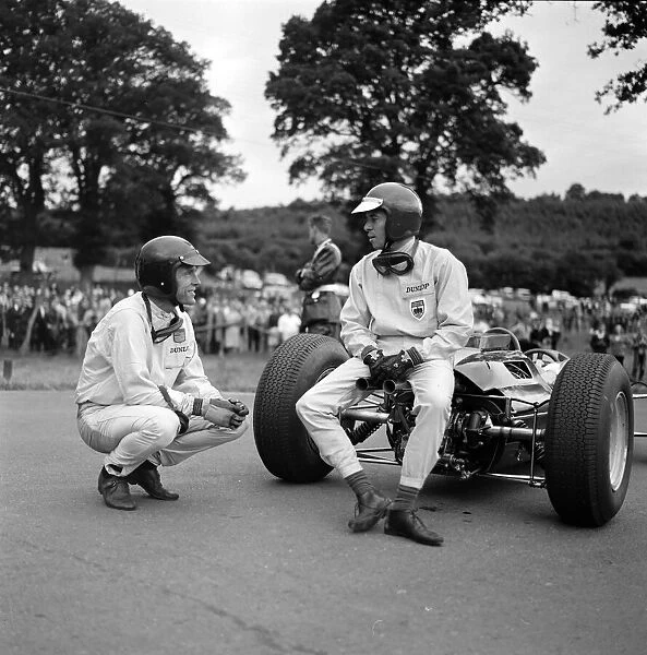 1964 Belgian GP. AUSTIN, TEXAS - JUNE 14: Jim Clark has a conversation