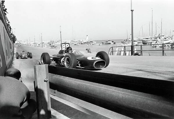 1964 Monaco Grand Prix. Monte Carlo, Monaco. 10 May 1964. Dan Gurney, Brabham BT7-Climax, retired, leads Graham Hill, BRM P261, 1st position, action. World Copyright: LAT Photographic Ref: L64 / 99 / 16