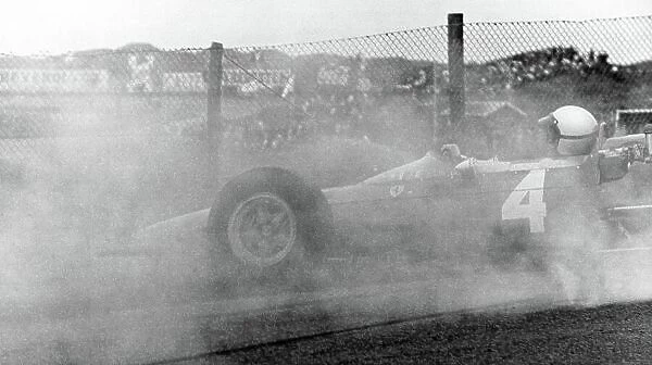 1965 Dutch Grand Prix. Zandvoort, Holland. 18 July 1965. Lorenzo Bandini, Ferrari 158, 9th position, spins, action. World Copyright: LAT Photographic Ref: Motor b&w print