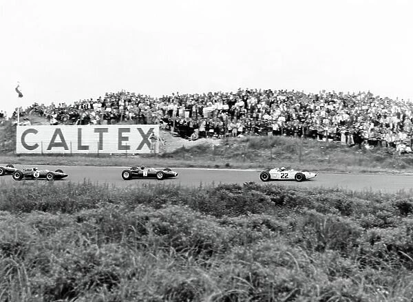 1965 Dutch Grand Prix. Zandvoort, Holland. 18 July 1965. Richie Ginther, Honda RA272, 6th position, leads Graham Hill, BRM P261, 4th position, and Jim Clark, Lotus 33-Climax, 1st position, action. World Copyright: LAT Photographic Ref: 30143