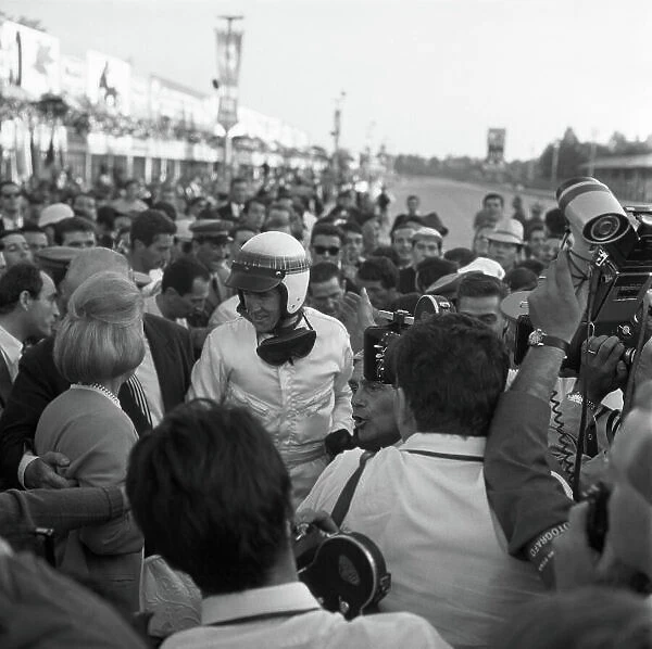 1965 Italian Grand Prix. Monza, Italy. 12th September 1965. Jackie Stewart (BRM P261), 1st position, celebrates his maiden Grand prix victory in the pit lane with Louis and Jean Stanley, portrait. World Copyright: LAT Photographic. Ref: 30884