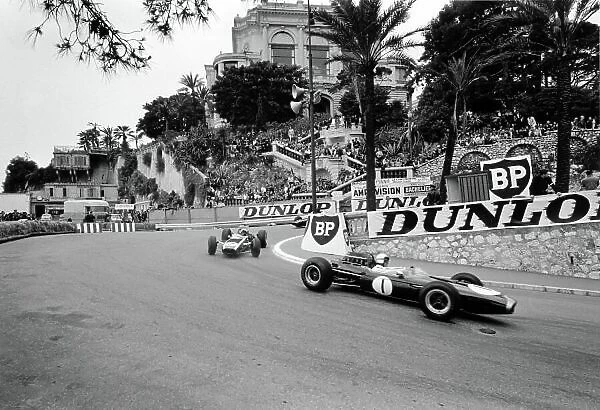 1965 Monaco Grand Prix. Monte Carlo, Monaco. 28-30 May 1965. Jack Brabham, Brabham BT11, retired, leads Bruce McLaren, Cooper T77, 5th position, action. World Copyright - LAT Photographic Ref: L65 / 219 / 7A