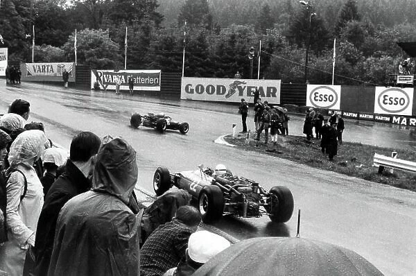 1966 Belgian Grand Prix. Spa-Francorchamps, Belgium. 12 June 1966. Richie Ginther, Cooper T81-Maserati, 5th position, leads Guy Ligier, Cooper T81-Maserati, not classified, action. World Copyright: LAT Photographic Ref: Motor b&w print