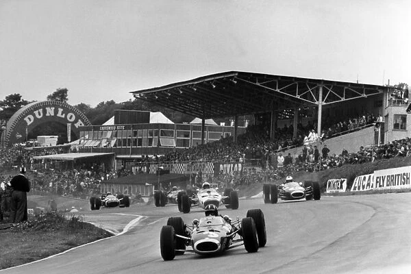 1966 British Grand Prix: Graham Hill, BRM P261, 3rd position, leads Jack Brabham, Brabham BT19-Repco, 1st position, Bruce McLaren, McLaren M2B-Serenissima