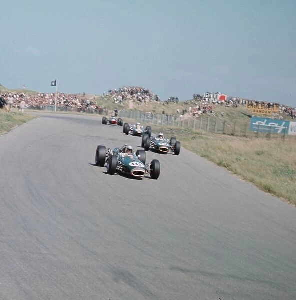 1966 Dutch Grand Prix: Jack Brabham leads Denny Hulme and Jim Clark. Brabham and Clark finished in 1st and 3rd positions respectively