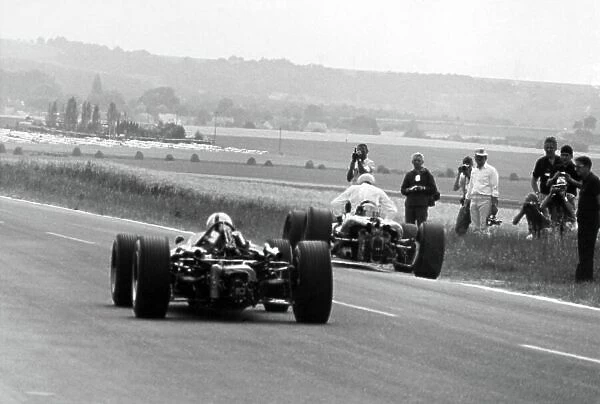 1966 French Grand Prix. Reims, France. 3 July 1966. Jack Brabham, Brabham BT19-Repco, 1st position, takes the lead, action. World Copyright: LAT Photographic