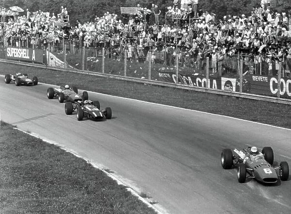1966 Italian Grand Prix. Monza, Italy. 4 September 1966. Ludovico Scarfiotti, Ferrari 312, 1st position, leads John Surtees, Cooper T81-Maserati, retired, Michael Parkes, Ferrari 312, 2nd position, and Denny Hulme, Brabham BT20-Repco, 3rd position