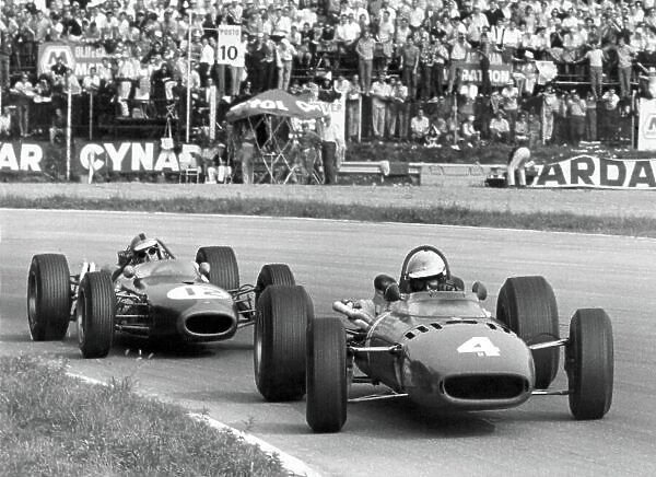 1966 Italian Grand Prix. Monza, Italy. 4 September 1966. Michael Parkes, Ferrari 312, 2nd position, leads Denny Hulme, Brabham BT20-Repco, 3rd position, action. World Copyright: LAT Photographic Ref: Motor b&w print