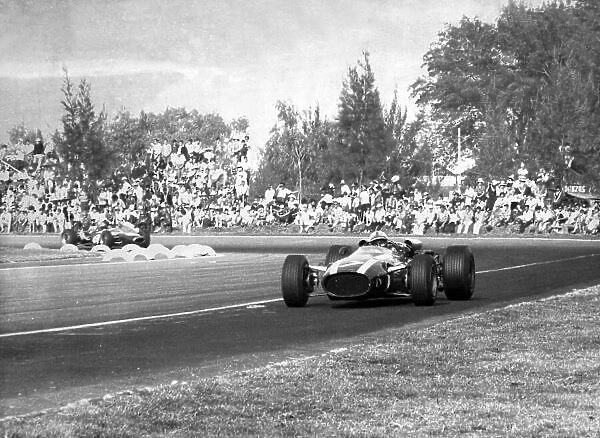 1966 Mexican Grand Prix. Mexico City, Mexico. 23 October 1966. John Surtees, Cooper T81-Maserati, 1st position, action. World Copyright: LAT Photographic Ref: b&w print