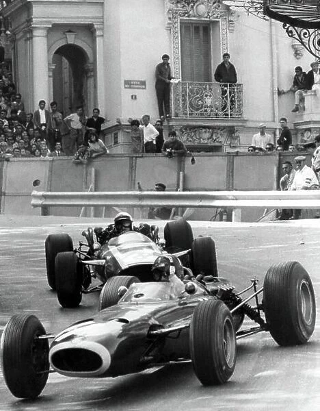 1966 Monaco Grand Prix. Monte Carlo, Monaco. 22 May 1966. Graham Hill, BRM P261, 3rd position, leads Jo Bonnier, Cooper T81-Maserati, not classified, at the finish, action. World Copyright: LAT Photographic Ref: Autosport b&w print