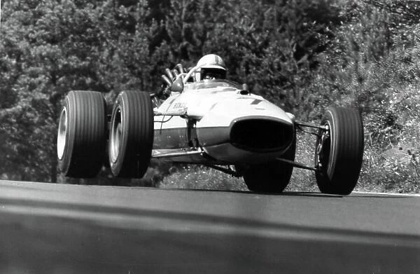 1967 German Grand Prix. Nurburgring, Germany. 6 August 1967. John Surtees, Honda RA273, 4th position, jump, action. World Copyright: LAT Photographic Ref: Motor b&w print