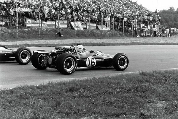 1967 Italian Grand Prix. Monza, Italy. 8-10 September 1967. Jim Clark (Lotus 49 Ford), 3rd position, is passed by Jack Brabham (Brabham BT24), at Parabolica telling him he has a punture, action. World Copyright - LAT Photographic. ref: 1726 #15A