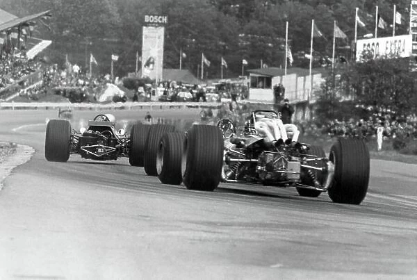 1968 Belgian Grand Prix. Spa-Francorchamps, Belgium. 9 June 1968. Bruce McLaren, McLaren M7A-Ford, 1st position, leads Pedro Rodriguez, BRM P133, 2nd position (obscured), and Jacky Ickx, Ferrari 312, 3rd position