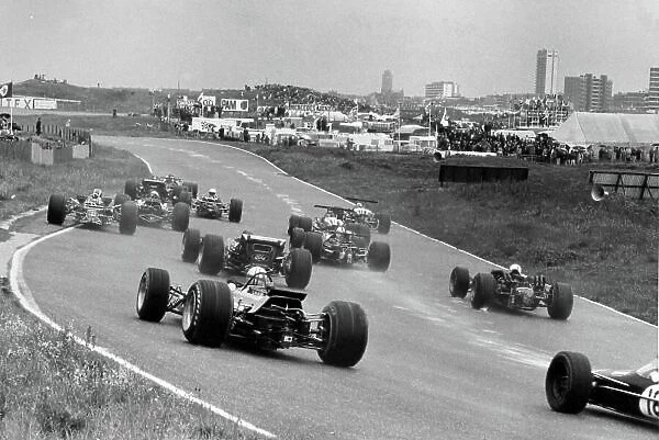 1968 Dutch Grand Prix. Zandvoort, Holland. 23 June 1968. Graham Hill, Lotus 49B-Ford, 9th position, leads at the start, action. World Copyright: LAT Photographic Ref: Motor b&w print