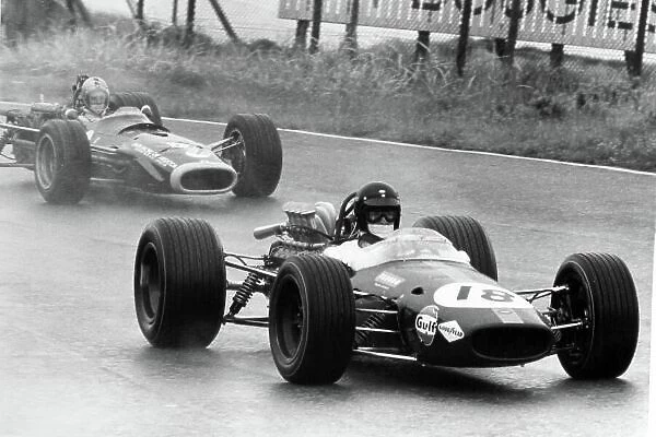 1968 Dutch Grand Prix. Zandvoort, Holland. 23 June 1968. Dan Gurney, Brabham BT24-Repco, retired, leads Piers Courage, BRM P126, retired, action. World Copyright: LAT Photographic Ref: Motor b&w print