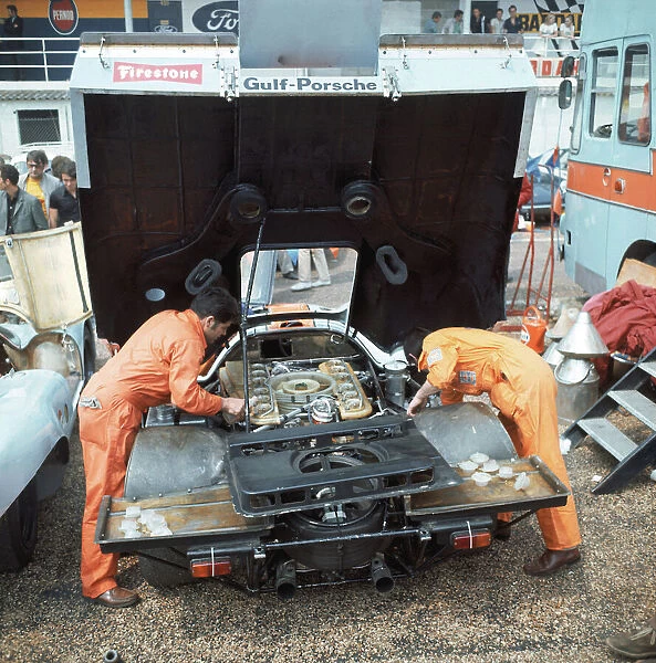 1970 Le Mans 24 Hours: Gulf Porsche team mechanics at work in the paddock