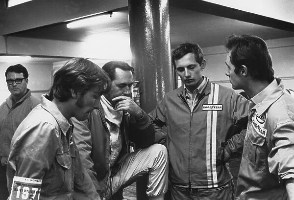 1970 Monaco Grand Prix: Jack Brabham 2nd position, chats with a young Ron Dennis in the pits, portrait
