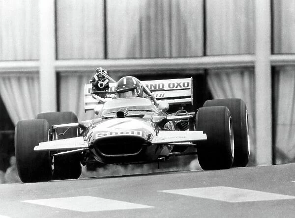 1970 Monaco Grand Prix. Monte Carlo, Monaco. 7-10 May 1970. Graham Hill (Lotus 49C-Ford Cosworth) with an early on-board television camera. TV. World Copyright: LAT Photographic Ref: Autosport b&w ptint