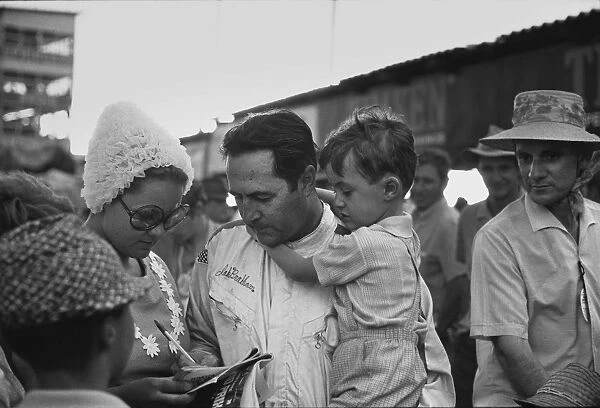 1970 South African Grand Prix: Jack Brabham talks to his wife, Betty with son David, in his arms, portrait