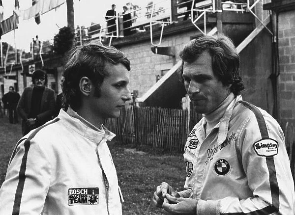 1971 European Formula 2 Championship. Rouen-les-Essarts, France. 27th June 1971. Rd 6. Niki Lauda (March 712M - Cosworth0, 4th position talks to Dieter Quester (March 712M - BMW), 2nd position in the paddock, portrait