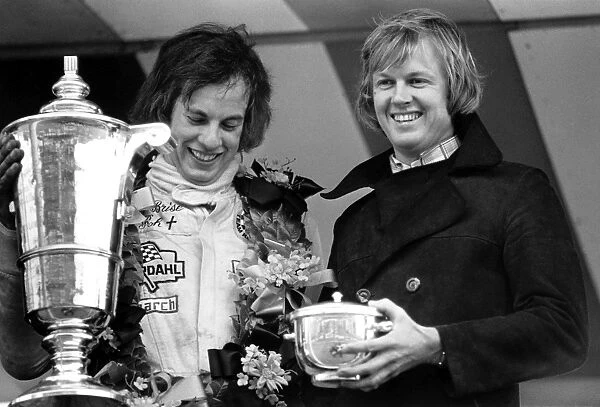 1973 British Formula Three Championship: Tony Brise, 1st position, recieves his winning trophies from Ronnie Peterson after winning the race and championship