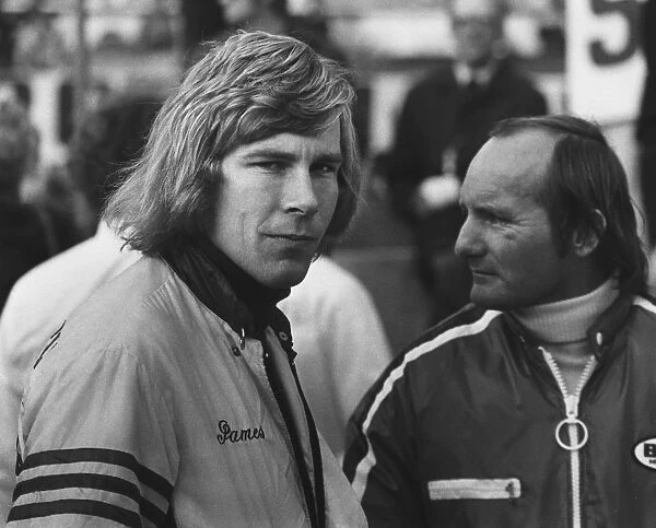 1973 Formula 1 World Championship: James Hunt with Mike Hailwood in the pits, portrait