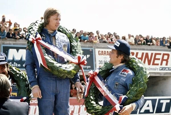 1974 French Grand Prix: Ronnie Peterson, 1st position, with Niki Lauda, 2nd position and Clay Regazzoni, 3rd position, podium, portrait